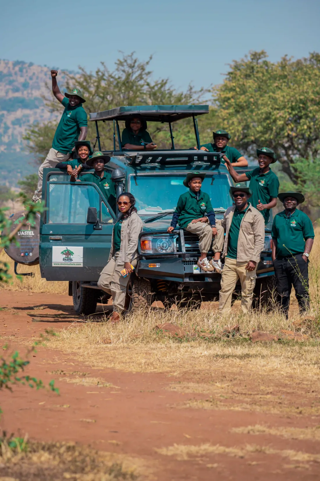 The Dastel Tour and Safaris team with their safari vehicle