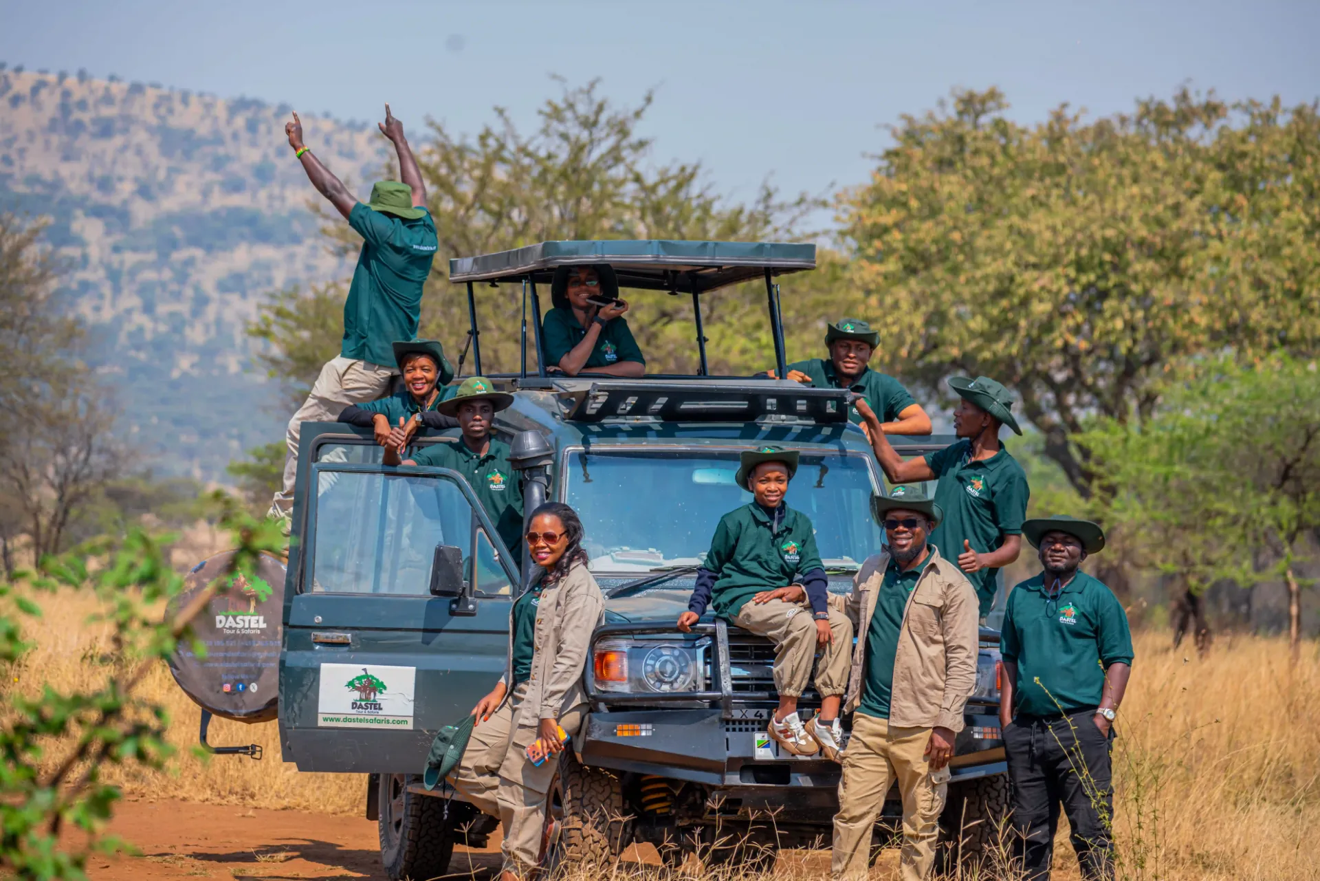 The Dastel Tour and Safaris team with their safari vehicle